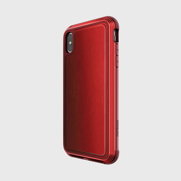 A red Raptic iPhone XS Case - LUX with a textured back is elegantly displayed at an angle against a plain background, highlighting its impact-resistant polycarbonate design.