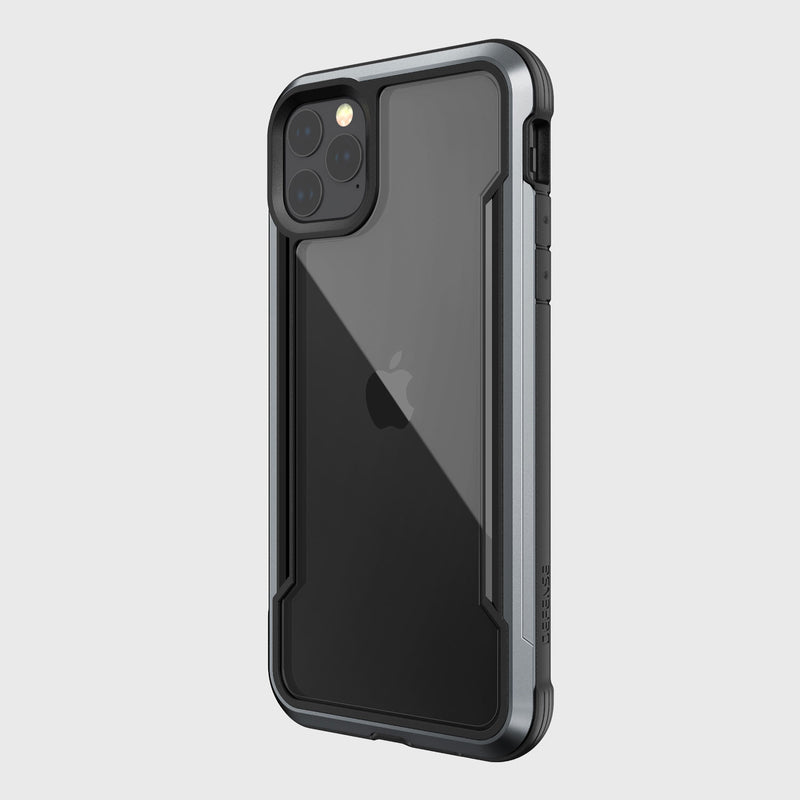 The iPhone 11 Pro Max with the Raptic SHIELD transparent case showcases its triple camera lenses, visible Apple logo, and light gray background while offering superior drop protection in a sleek style.