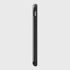 Side view of a durable black Raptic iPhone 11 Pro Max Case - SHIELD, featuring visible buttons and a camera bump, crafted from aluminum alloy, against a plain gray background.