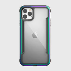 The Raptic SHIELD case for iPhone 11 Pro features a transparent back with an aluminum alloy metallic green trim and visible rear cameras. It supports wireless charging, presenting an elegant look on a gray background.