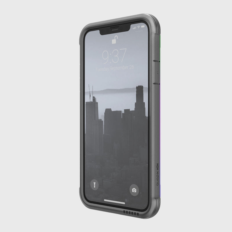 The iPhone 11, highlighted by aluminum alloy edges and a grayscale cityscape wallpaper, shows the time as 9:37 on Tuesday, September 26. Protected by a Raptic SHIELD case, it offers ultimate convenience with wireless charging compatibility.