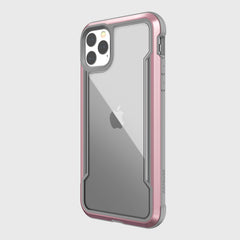 The Raptic SHIELD case for iPhone 11 Pro is a sleek, clear, and pink protective cover with an aluminum alloy silver border. It blends style with functionality and supports wireless charging.