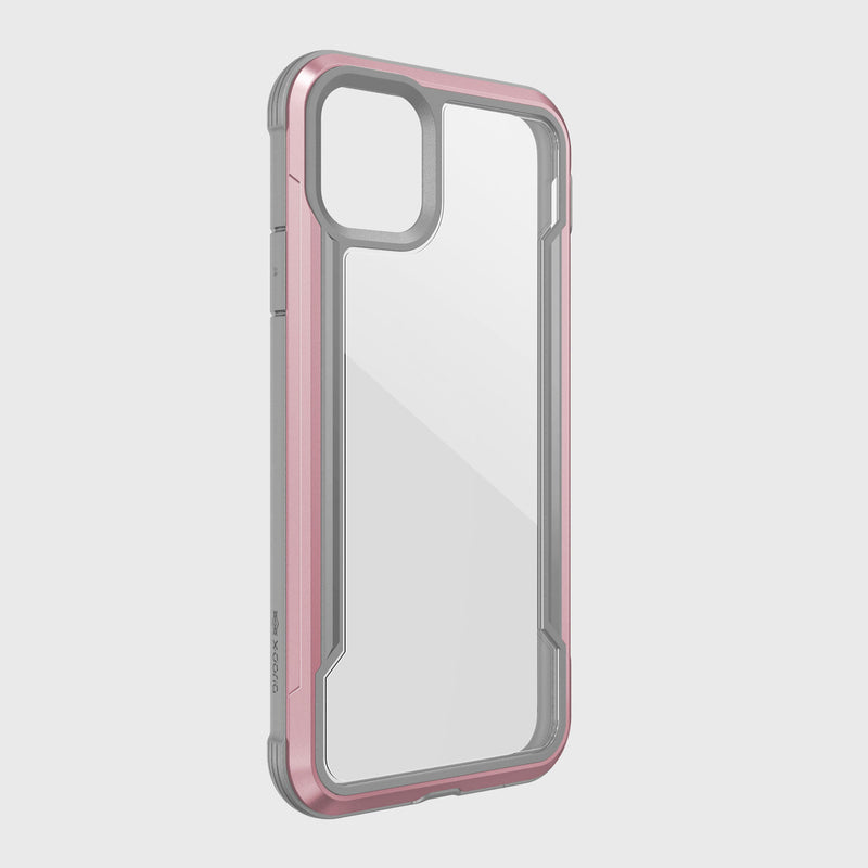 The Raptic iPhone 11 Case - SHIELD features a clear design with a metallic pink bumper, accommodates a dual-camera setup, and supports wireless charging. Its sleek and durable construction includes aluminum alloy elements for optimal protection.