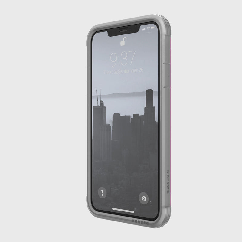 The iPhone 11 Pro Max is secured in the Raptic SHIELD case, displaying a cityscape on its lock screen at 9:37. Designed with drop protection and an aluminum alloy frame, it withstands everyday adventures while maintaining a sleek look.