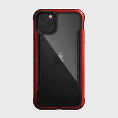 A Raptic SHIELD case with drop protection and a sleek aluminum alloy design encases a smartphone. The red and black cover sports the iconic Apple logo on the back.