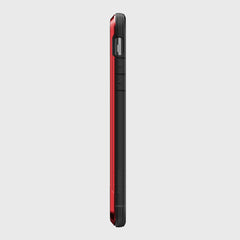 Side view of the Raptic SHIELD iPhone 11 Pro Max case in black and red, featuring button cutouts, a textured edge, and robust drop protection against a gray background.