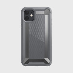 The Raptic iPhone 11 Case - TACTICAL is a rugged gray smartphone case featuring a shock-absorbing rubber exterior and hexagonal pattern. Designed to protect dual rear cameras, it meets Military Standard MIL-STD-810G for robust durability.