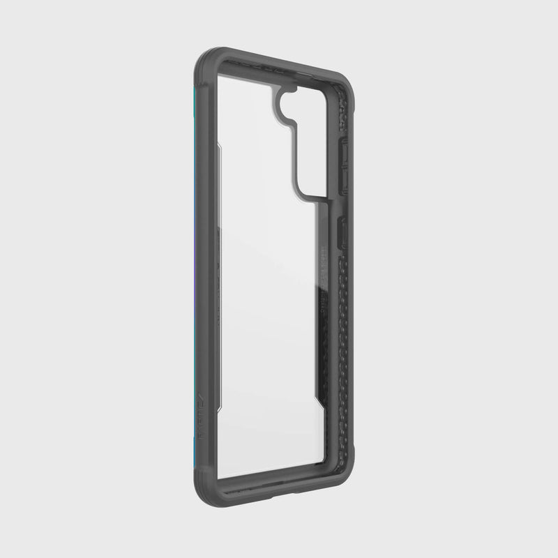 The X-Doria Raptic Shield Iridescent case for Samsung Galaxy S21 combines style and military-grade protection. It features precise cutouts for buttons and camera, ensuring wireless charging compatibility, and is shown against a plain white background with a dark frame.