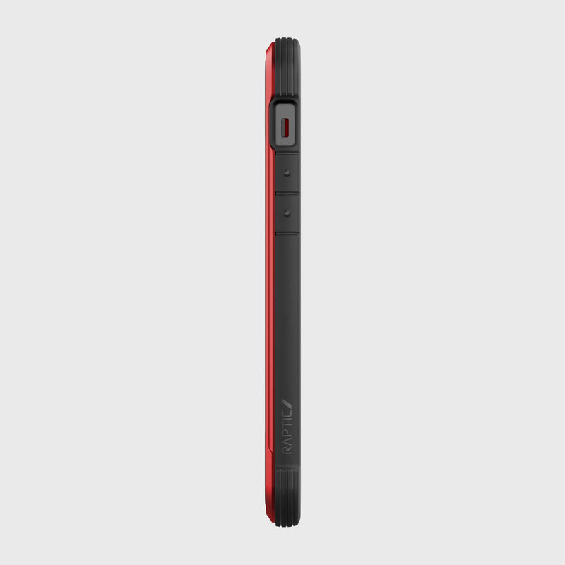 Side view of an iPhone 12 in a red and black SHIELD PRO MAGNET case by Raptic, highlighting buttons and speaker. This rugged iPhone 12 & iPhone 12 Pro case is designed for superior drop protection and integrates seamlessly with MagSafe chargers.