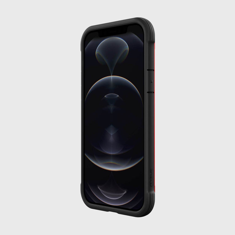 The Raptic SHIELD PRO MAGNET case for iPhone 12 features a dark, abstract wallpaper design in a red and black protective cover that complements MagSafe chargers and ensures drop protection.