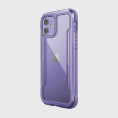 The Raptic iPhone 12 Raptic Shield case in purple features a transparent back that showcases the Apple logo. With a machined aluminum bumper for military-grade drop protection, it remains wireless charging compatible for ultimate convenience.