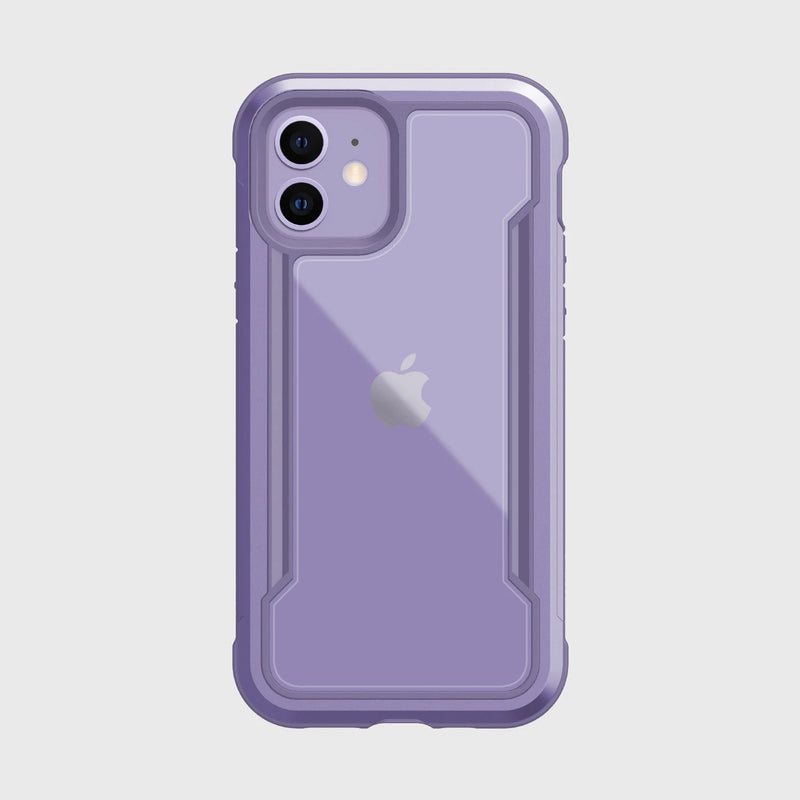 The Raptic iPhone 12 Raptic Shield case in purple features a logo-revealing clear back and offers military-grade drop protection for the camera and edges. Designed on a white background, it's compatible with wireless charging, blending convenience with style.