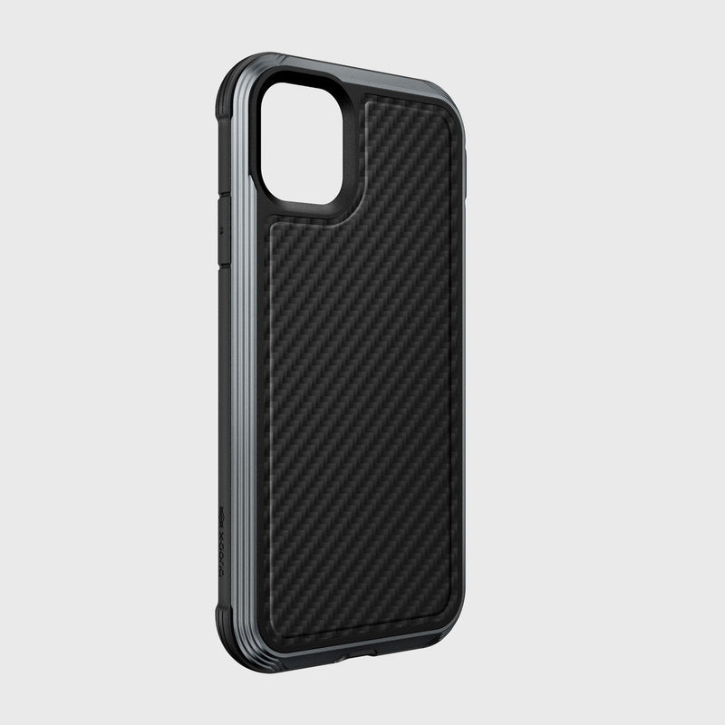 The Raptic LUX case for iPhone 11 Pro Max features a black carbon fiber pattern, crafted from impact-resistant polycarbonate. It includes camera cutouts, side button covers, wireless charging compatibility, and is showcased against a plain light gray background.