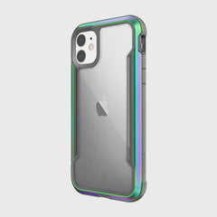 The Raptic SHIELD iPhone 11 Case is a clear protective case with a durable aluminum alloy border in metallic green and purple. It provides robust protection while remaining compatible with wireless charging.