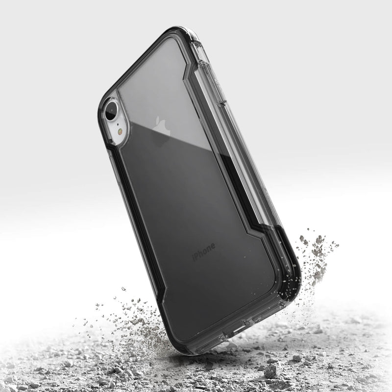 The back of a Raptic iPhone XR Case - CLEAR with sand on it.