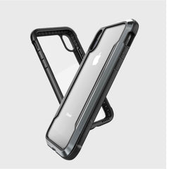 Two Raptic SHIELD transparent iPhone XR cases with black borders, showcasing the device, feature military-grade drop protection. They are displayed in an overlapping design to emphasize shock absorption and style.