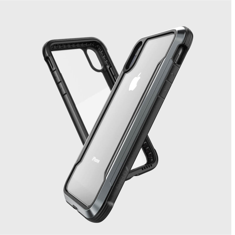 Two Raptic SHIELD transparent iPhone XR cases with black borders, showcasing the device, feature military-grade drop protection. They are displayed in an overlapping design to emphasize shock absorption and style.