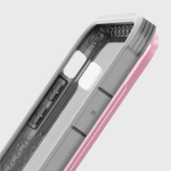 Close-up of a Raptic iPhone XR Case - SHIELD, showcasing a pink and gray design with button and camera cutouts. The inner surface offers a textured pattern for better grip, providing military-grade drop protection.