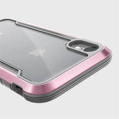 Close-up of a smartphone in a pink and gray Raptic SHIELD iPhone XR case, highlighting the camera and back with military-grade drop protection for shock absorption.