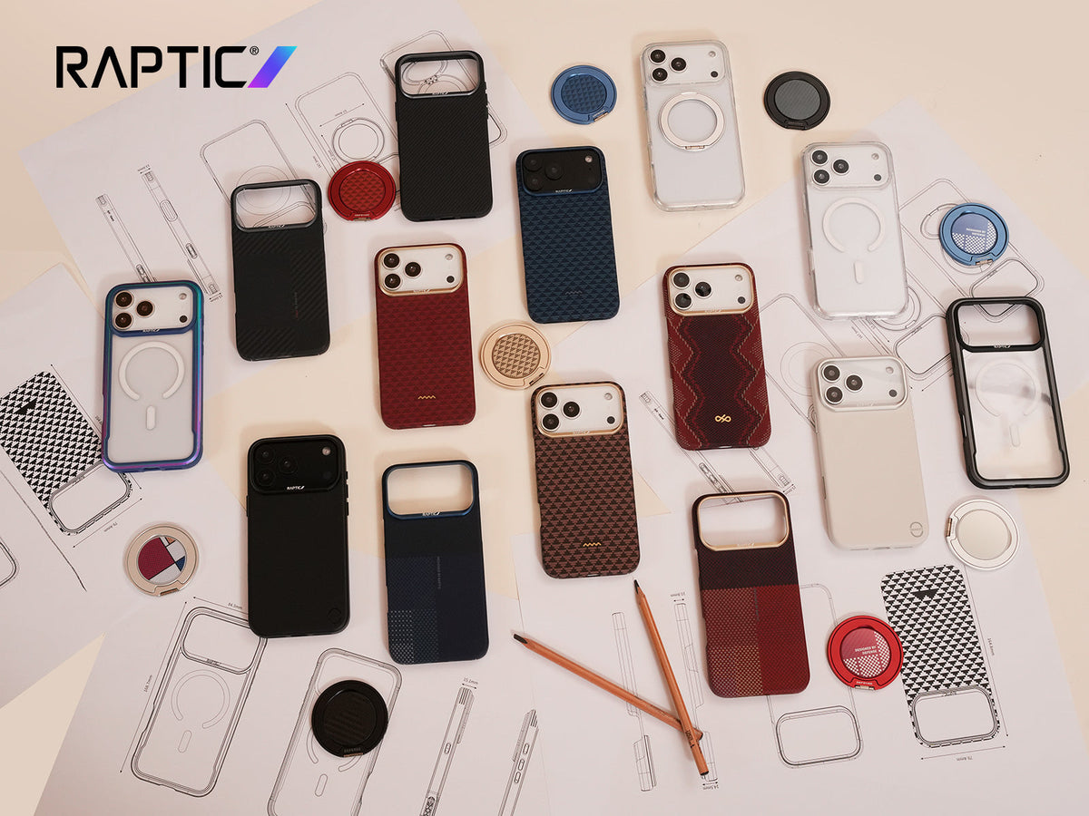 A variety of Raptic-branded phone cases and accessories are arranged on top of technical sketches and architectural plans, with pencils and a color wheel nearby.