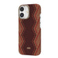 An iPhone 17 with a dual-lens camera is displayed in the Raptic Skin-Origin aramid fibre case, featuring a brown and red zigzag pattern, MagSafe compatibility, and a small infinity symbol near the bottom.