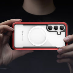 Hands holding a Samsung Galaxy S25 encased in a Raptic SHIELD case with a red border, military-grade drop protection, and an advanced triple-camera setup, viewed from the back.