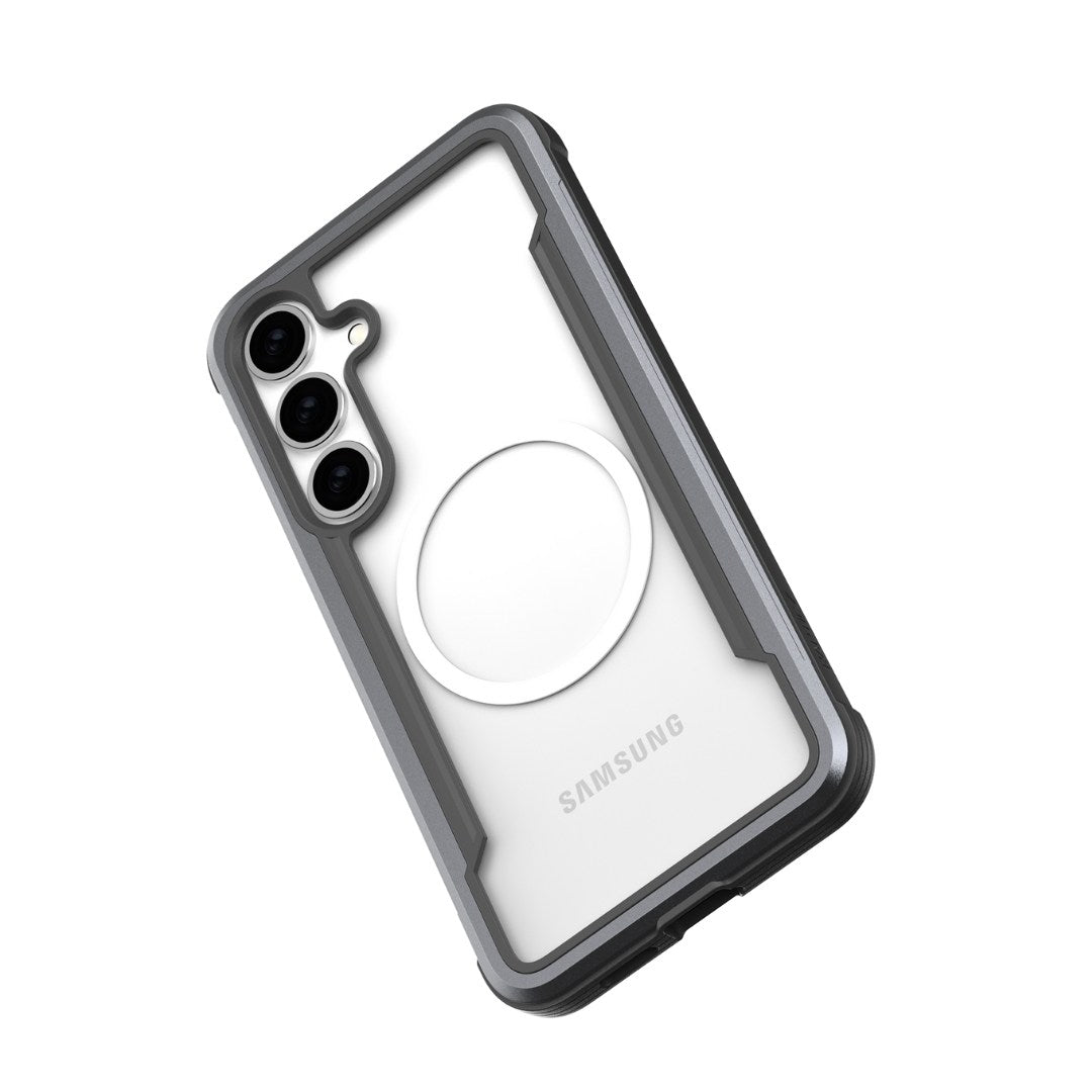 The Samsung Galaxy S25 Case by Raptic, called SHIELD, is rugged in black and gray with military-grade drop protection and features a distinctive white circle on the back positioned diagonally on a white background.