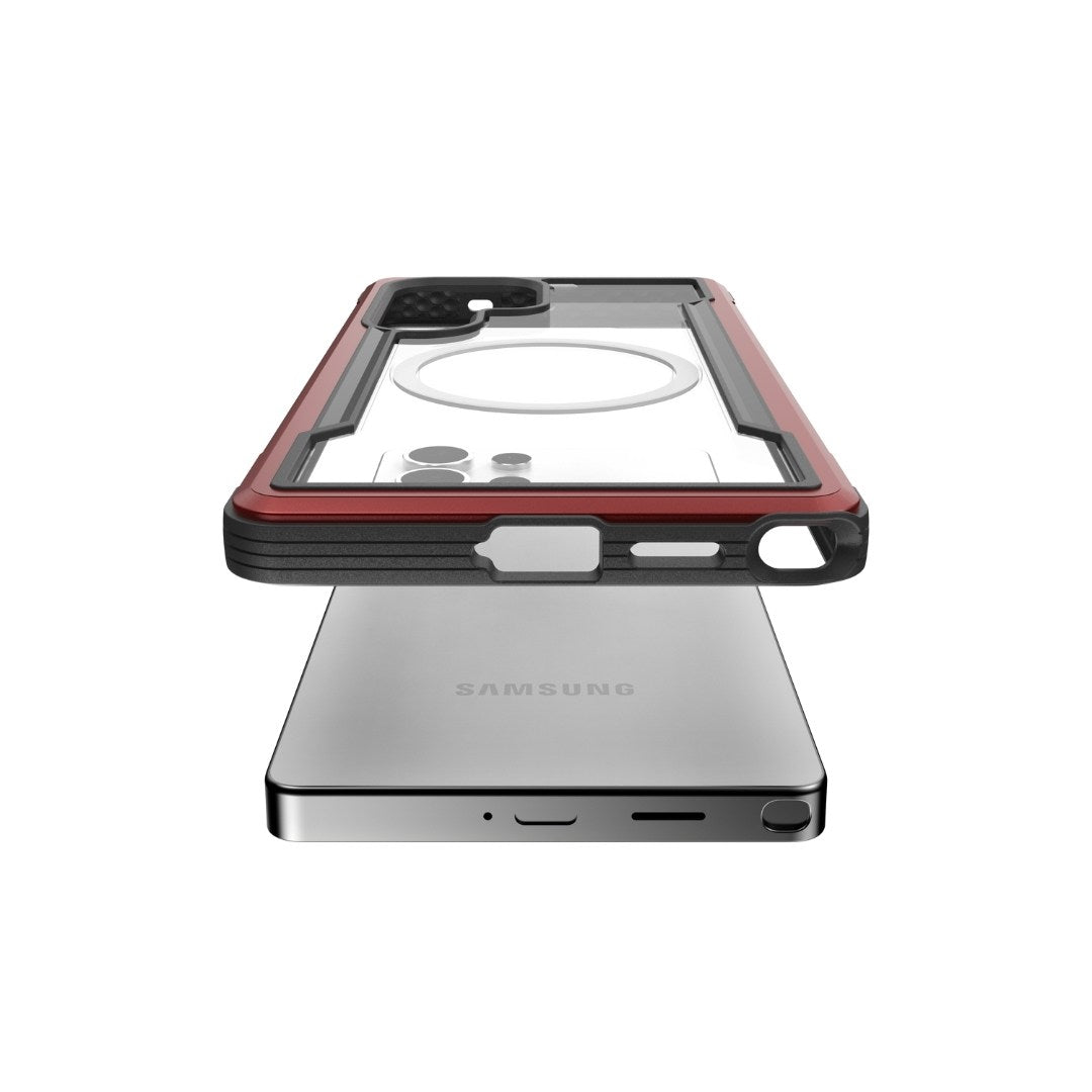 Hovering above a Samsung smartphone, the transparent and red Raptic SHIELD Galaxy S25 case features camera cutouts and side button slots, providing military-grade drop protection.