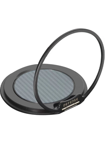 A MagSafe compatible black circular magnetic phone ring holder by Raptic, featuring a metallic ring and carbon fiber-patterned center, labeled 