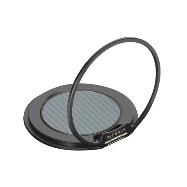 A MagSafe compatible black circular magnetic phone ring holder by Raptic, featuring a metallic ring and carbon fiber-patterned center, labeled 