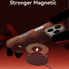 Close-up of the Raptic Skin-Origin iPhone 17 Aramid Fibre Case held above a MagSafe-compatible charger, featuring text: 