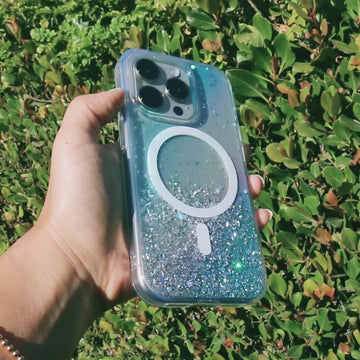 A person holding an iPhone 15 Starburst Glitter MagSafe Case - Bryten by Raptic, featuring MagSafe.