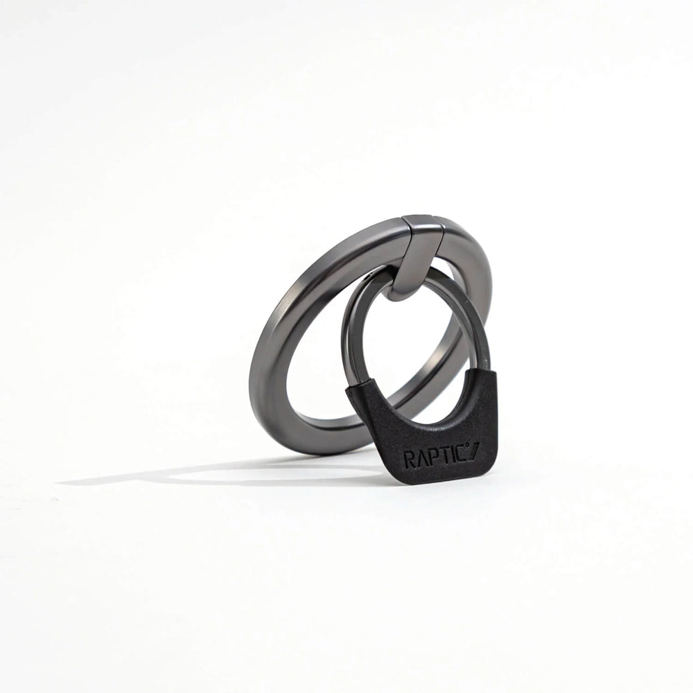 A Raptic MagSafe Ring Stand - Gunmetal on a white surface.