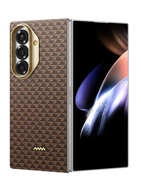 The Raptic Samsung Galaxy Z Fold 7 - Skin Origin Humble features a foldable design, a brown aramid fiber-patterned back, triple rear cameras in a gold module, and a large unfolded display with abstract graphics.