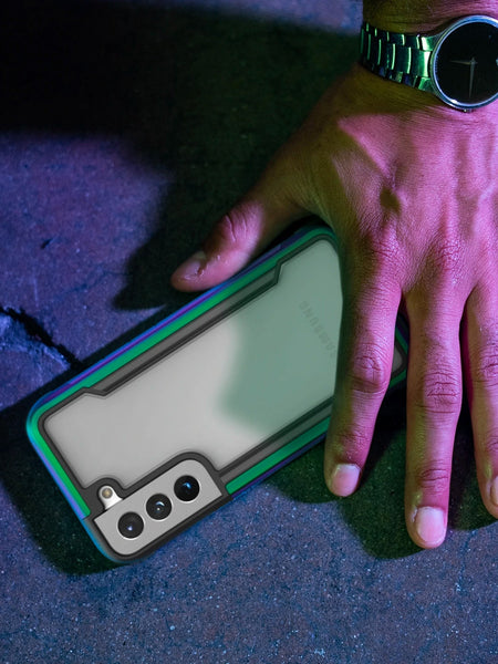 A hand holding a Raptic Shield case for the Samsung Galaxy S24 Plus phone, providing drop protection.