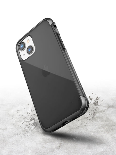 A protective black iPhone 14 Air Case - Raptic Air on a concrete surface.
