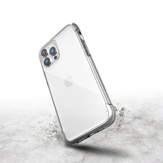 A sturdy metal iPhone 14 Pro protective case, the Raptic Air, on a concrete surface.