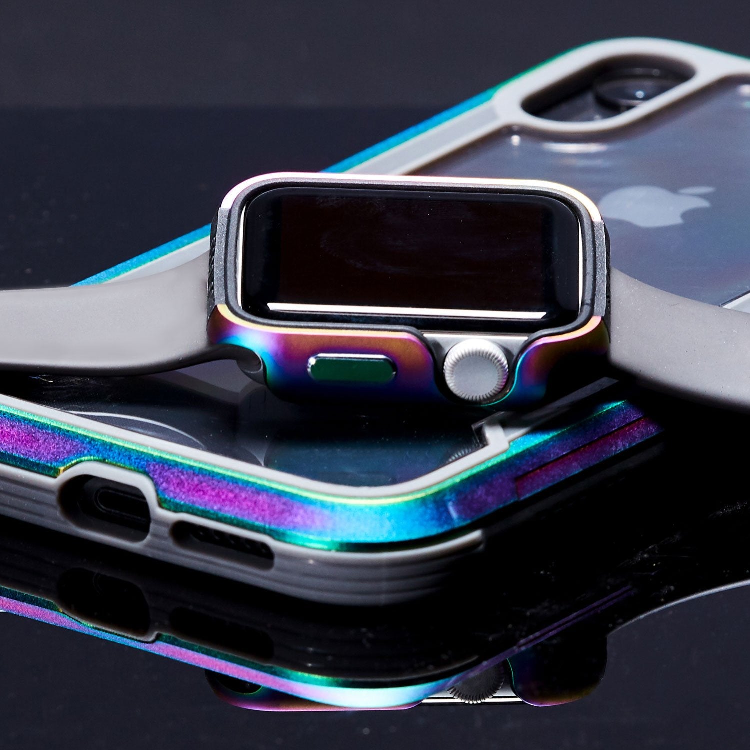 An iPhone case with a rainbow-colored Raptic Apple Watch 44mm Case - EDGE attached to it, crafted from premium machined anodized aluminum that protects your device.