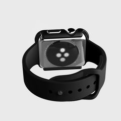 The image features the back view of the Raptic Apple Watch 40mm Case - EDGE with a black band, emphasizing its sensor area and anodized aluminum clasp.