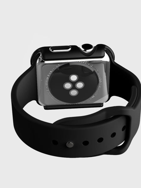 A smartwatch with a black band is shown from the back, highlighting its circular sensor area. The anodized aluminum finish complements the Raptic Apple Watch 38mm Case - EDGE, offering a sleek design and reliable scratch protection.