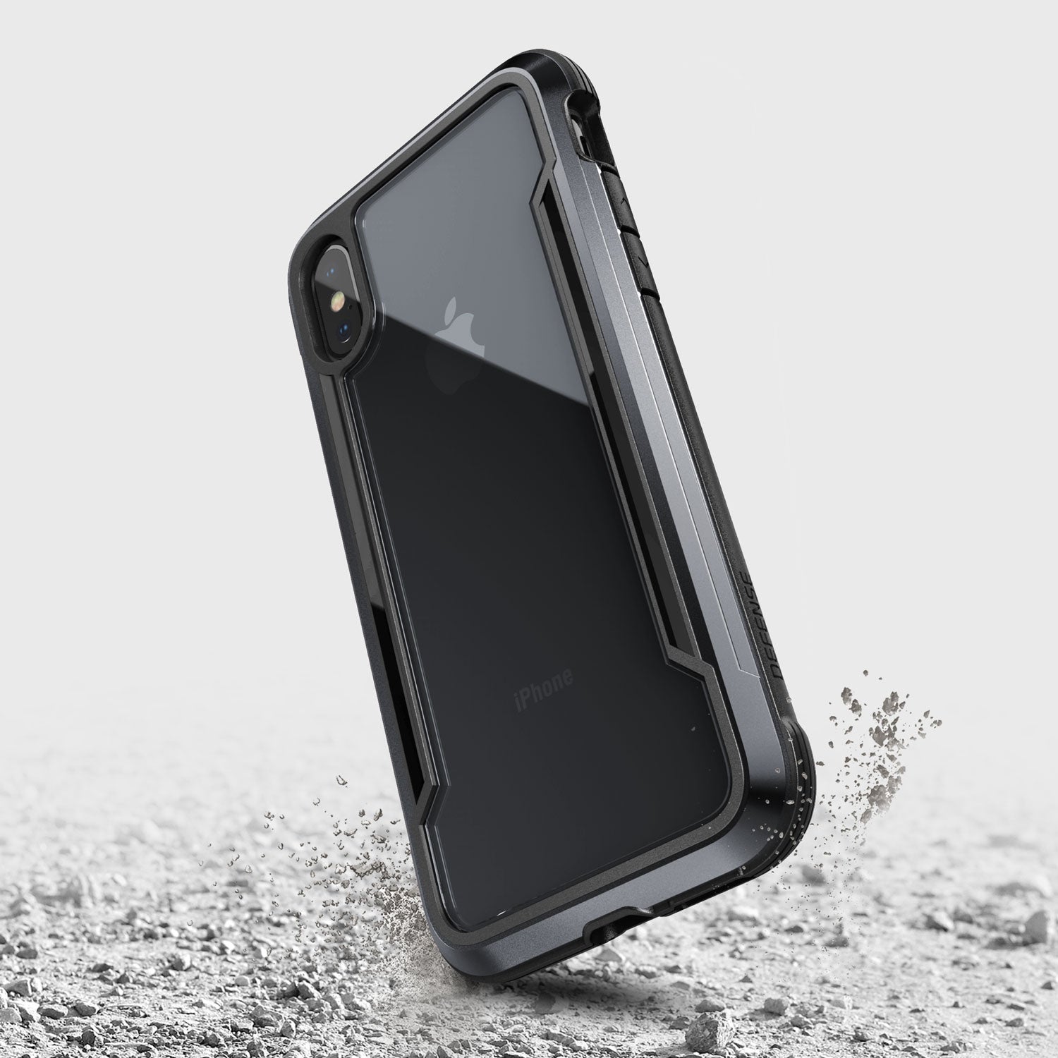 The protective iPhone XS Max Case - SHIELD, featuring a Raptic Shield design, has been dropped and lies on the ground.