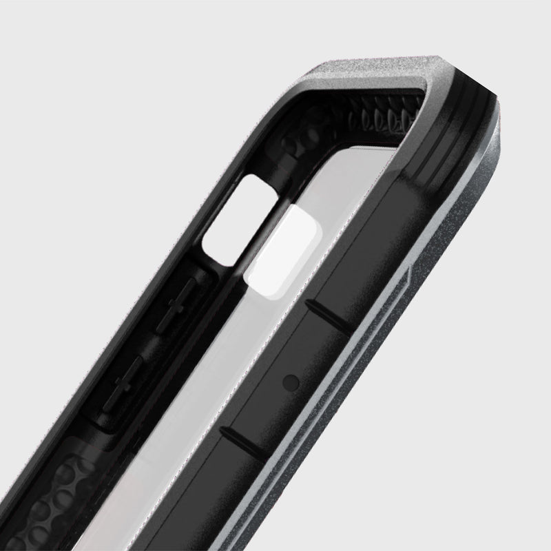 Close-up of a Raptic iPhone X/XS Case - SHIELD, black and gray, highlighting its military-grade drop protection. It has precise camera and button cutouts and a honeycomb design inside, set against a plain gray background.