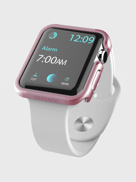 A white-banded Apple Watch 40mm Case - EDGE by Raptic shows an alarm for 7:00 AM and a time of 12:09. The watch case has a pink tint with anodized aluminum for durability.