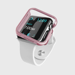 Smartwatch with a white band and pink protective Apple Watch 40mm Case - EDGE by Raptic for added scratch protection, showing the time 12:09 and an alarm set for 7:00 AM.