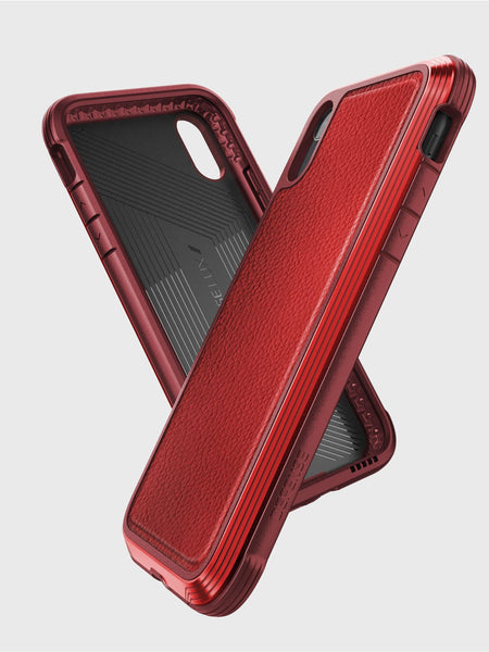 Two red Raptic iPhone XR LUX cases with textured backs are shown overlapping against a white background, crafted from impact-resistant polycarbonate for reliable defense.