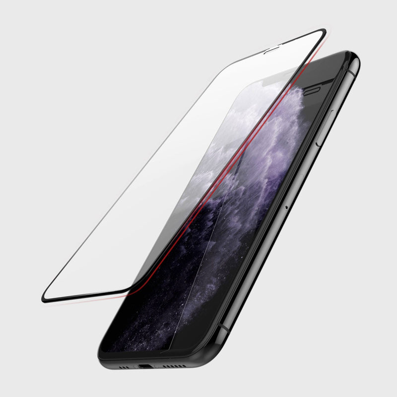 Defense Glass edge to edge is hovering over a black iphone 11 pro