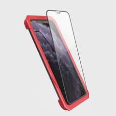 Showing defense glass flat on phone 11 pro using installation tool