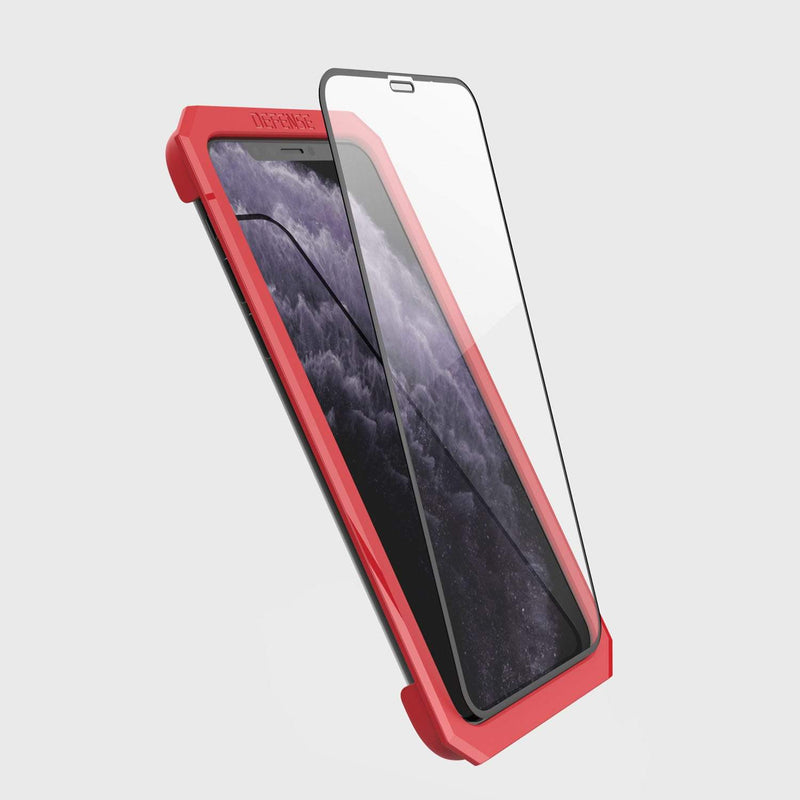 Showing defense glass flat on phone 11 pro using installation tool