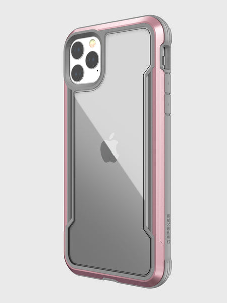 The Raptic SHIELD case for iPhone 11 Pro is a sleek, clear, and pink protective cover with an aluminum alloy silver border. It blends style with functionality and supports wireless charging.