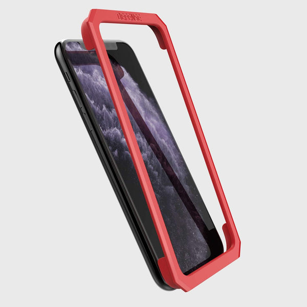 Showing the installation tool that is included and how it lays on the iPhone 11 pro max